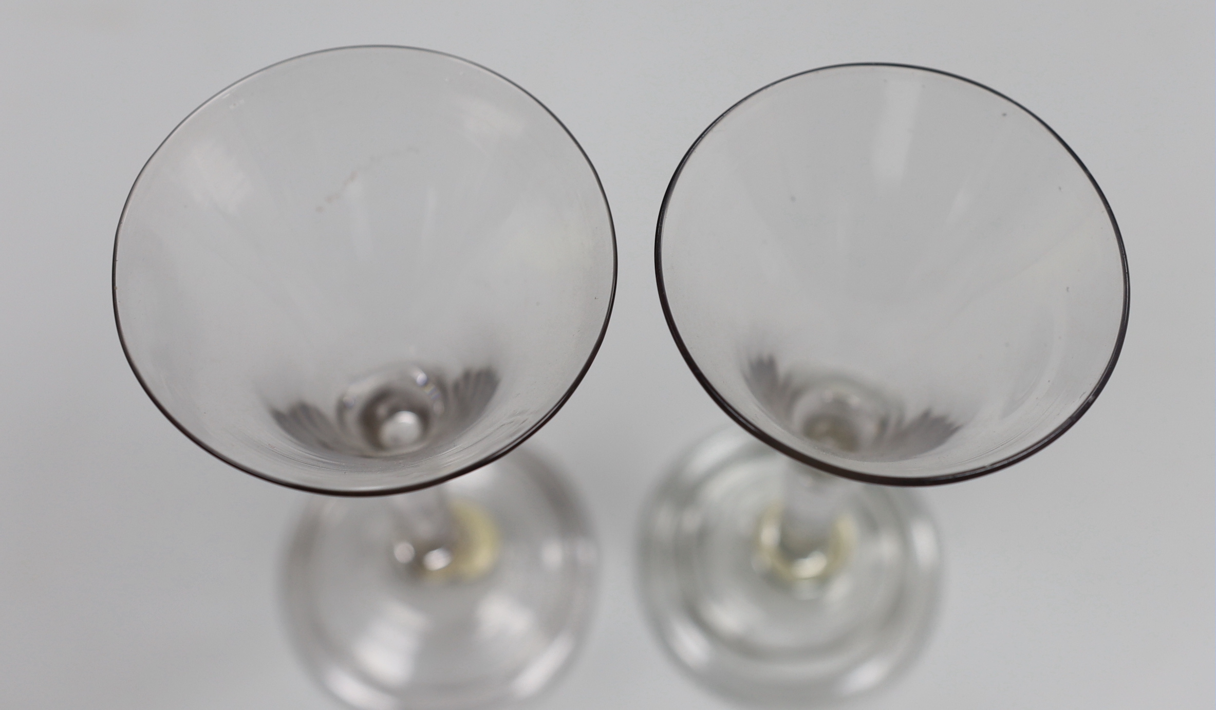 Two George II ‘drawn trumpet’ wine glasses, folded feet, tallest 16.5cm